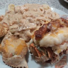 A picture of Stuffed lobster with shrimp,bacon and cheese.