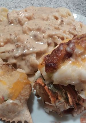 A picture of Stuffed lobster with shrimp,bacon and cheese.