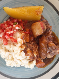 A picture of Mutton curry and creamy samp.