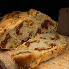 A picture of Sun dried tomatoes and olives bread.