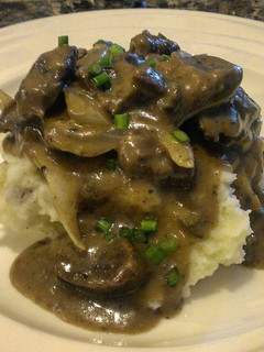 A picture of Beef Tips with Onion & Mushroom Gravy.