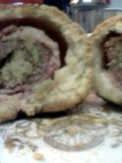 A picture of Bacon Wrapped, Broccoli & Artichoke Stuffed Steak, Homemade Bread Pockets w Savory Mushroom Tomato Paste Gravy.
