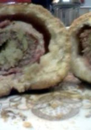 A picture of Bacon Wrapped, Broccoli & Artichoke Stuffed Steak, Homemade Bread Pockets w Savory Mushroom Tomato Paste Gravy.