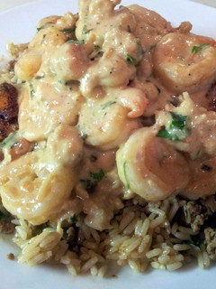 A picture of Cajun Blackened Salmon Seafood Cream sauce.