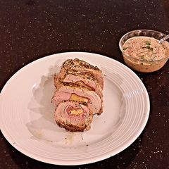 A picture of Pork Tenderloin Stuffed with Italian Meats.