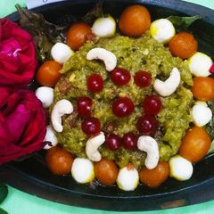 A picture of Sizzling dudhi halwa with mini gulab jamun and rasgulla.