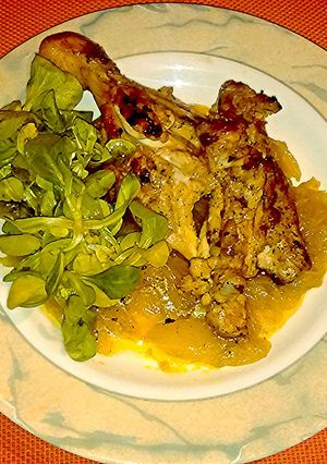 A picture of Whole chicken legs with curry onions..