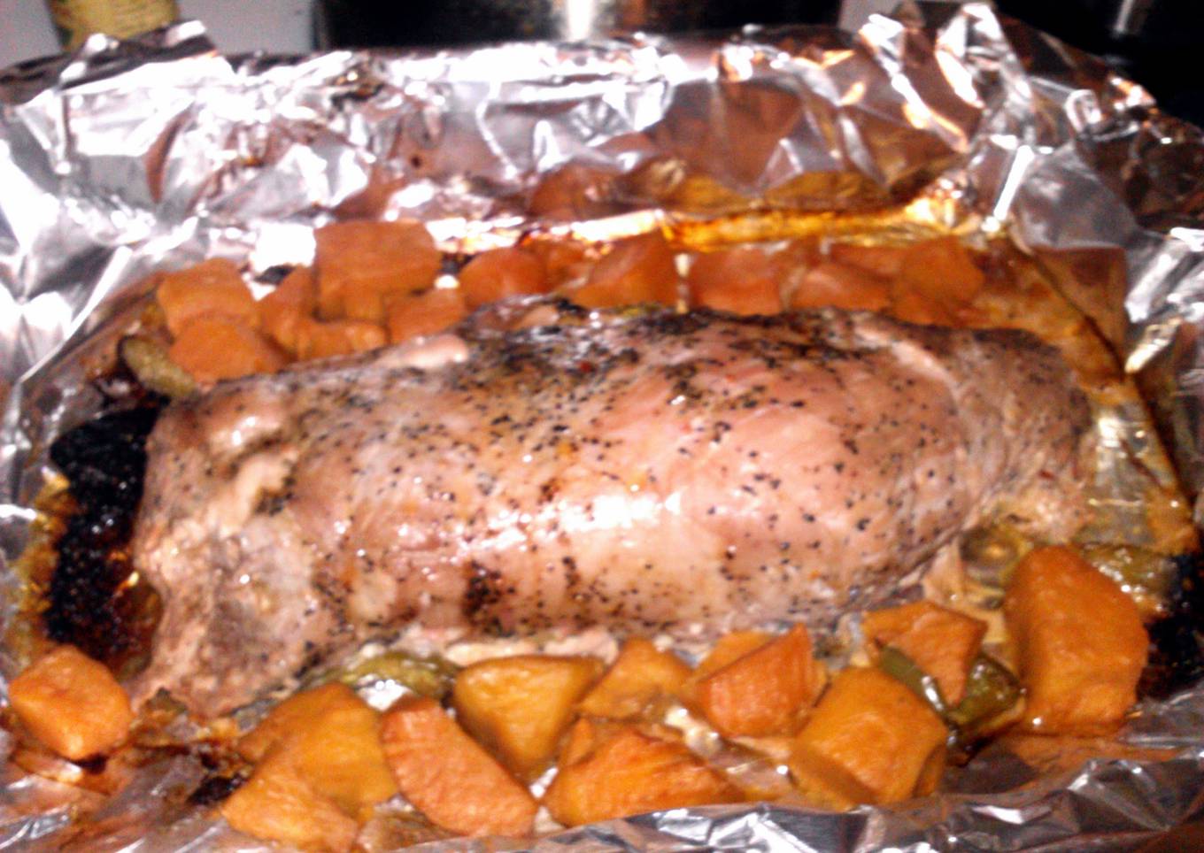 marinated pork tenderloin pepercorn and garlic with sliced sweet potatos