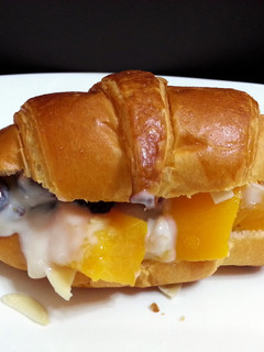 A picture of Peach Parfait On Croissant Breakfast.