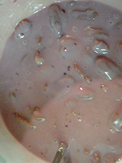 A picture of Pecans,Grape jam, and goat cheese base.
