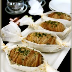 A picture of Easy Meat Wrapped Cheese Onigiri Using Kitchen Parchment Paper.