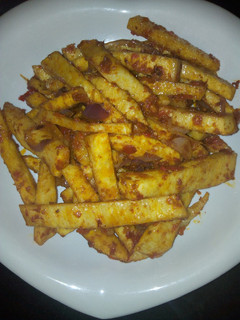 A picture of Freid yam in sauce.
