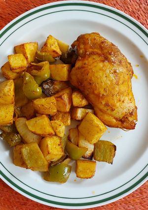 A picture of Chicken with Potatoes and Bell Pepper in the Air Fryer.
