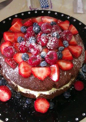 A picture of Red Velvet Cake with fruit.