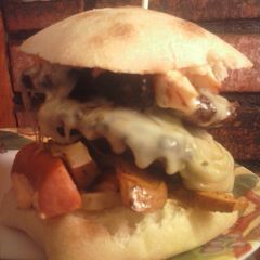 A picture of Brad's cajun burger with Louisiana hot sauce aioli.