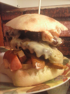 A picture of Brad's cajun burger with Louisiana hot sauce aioli.