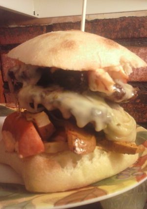 A picture of Brad's cajun burger with Louisiana hot sauce aioli.