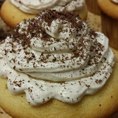 A picture of Vanilla cake with coffee butter cream frosting.