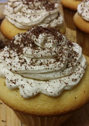 A picture of Vanilla cake with coffee butter cream frosting.