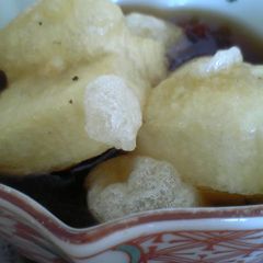 A picture of Warm Deep-Fried Mochi with Thick Ankake Sauce.