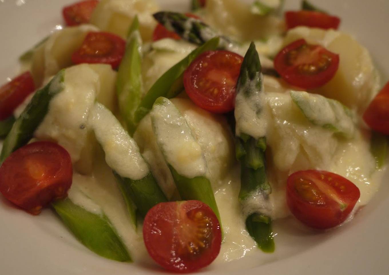 Warm salad with rich cheese sauce