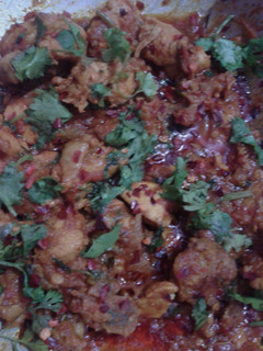 A picture of Indian spicy chicken with potato.