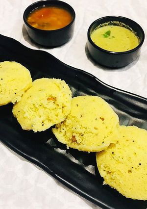A picture of Sambhar and Rawa Idli with Coconut Chutney.