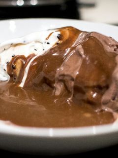 A picture of Hot chocolate Mars sauce with ice -cream.