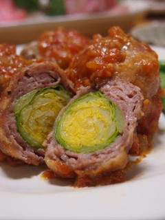 A picture of Meat-Wrapped Brussels Sprouts in Tomato Sauce.
