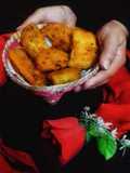 Shorsher puure Chalkumro (Fried ash gourd stuffed with mustard)