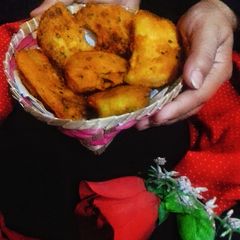 A picture of Shorsher puure Chalkumro (Fried ash gourd stuffed with mustard).