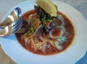 A picture of clams in soup