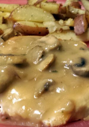 A picture of French country chicken with mushroom sauce.