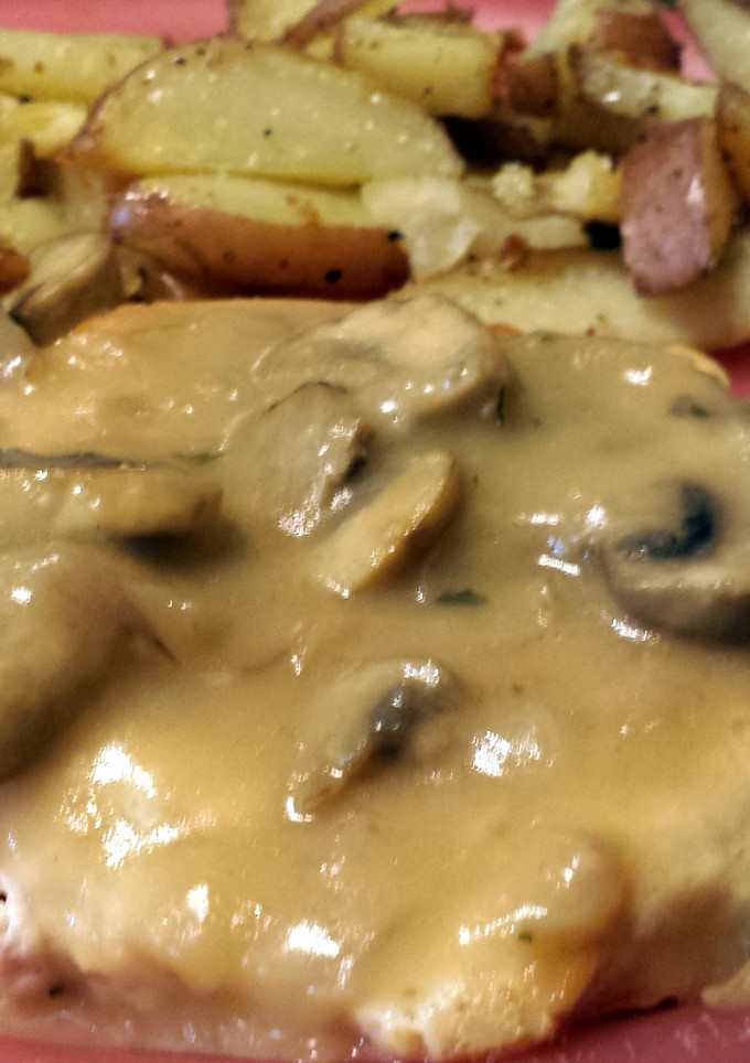 A picture of French country chicken with mushroom sauce.