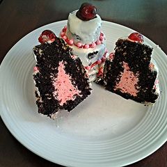 A picture of Chocolate Cakes with Cherry Cream Filling.