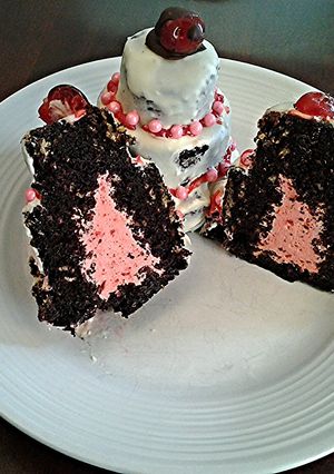 A picture of Chocolate Cakes with Cherry Cream Filling.