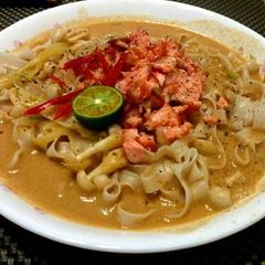 A picture of Salmon Thai Curry Noodle Soup.