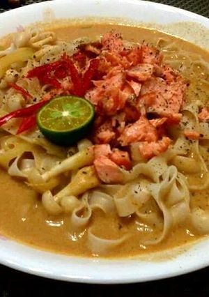 A picture of Salmon Thai Curry Noodle Soup.