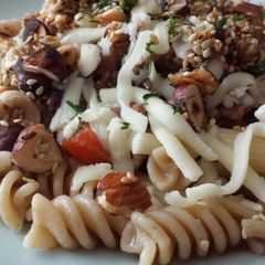 A picture of Pasta with beef mince and roasted nuts.