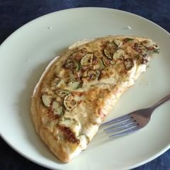 A picture of Green and cheesy omelette.