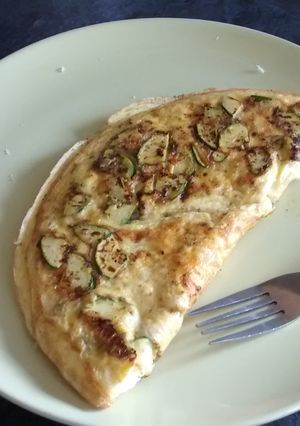 A picture of Green and cheesy omelette.