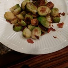 A picture of Pan Fried Brussel Sprouts with Blood Orange and Applewood Bacon.