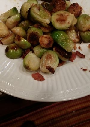 A picture of Pan Fried Brussel Sprouts with Blood Orange and Applewood Bacon.