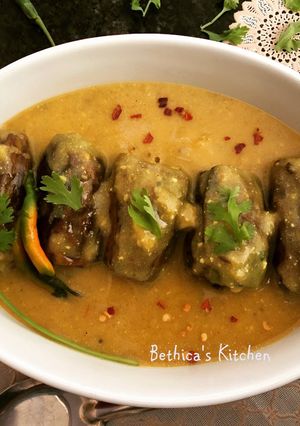 A picture of Bharwan Parwal Kadhi (Stuffed Pointed Gourd in Yoghurt Sauce).