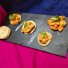 Indian gravy pasta with mini paratha bites A picture of Indian gravy pasta with mini paratha bites.