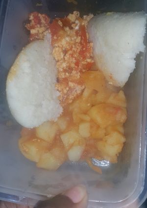 A picture of Scrambled eggs served with waru and ugali.