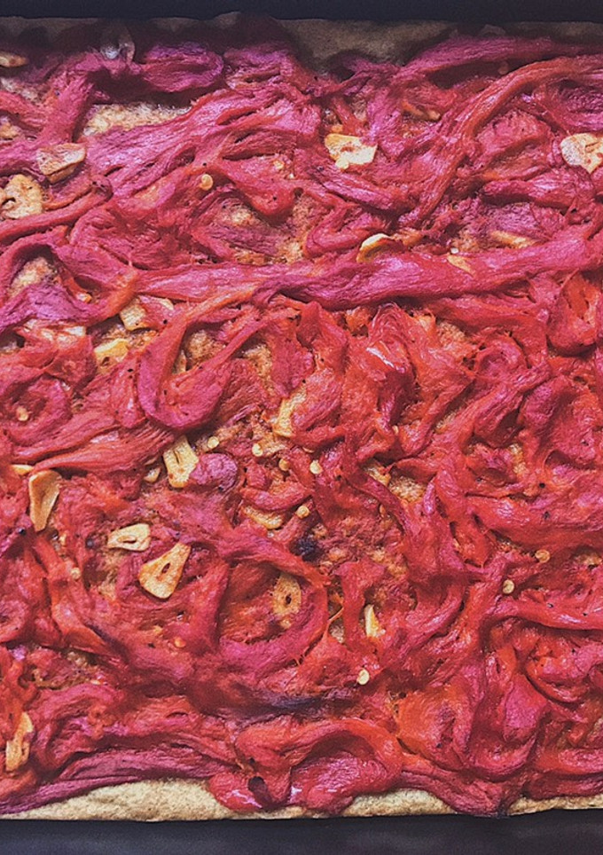 Una foto de Coca de pimientos