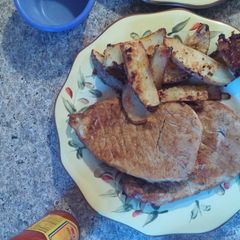 A picture of Pork butts n taters.
