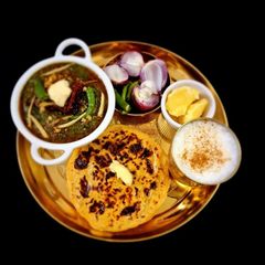 A picture of Sarson ka Saag and makki ki Roti.