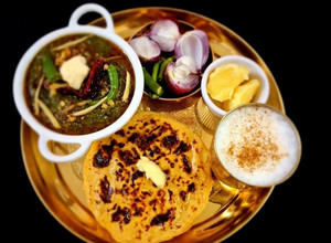 A picture of Sarson ka Saag and makki ki Roti.